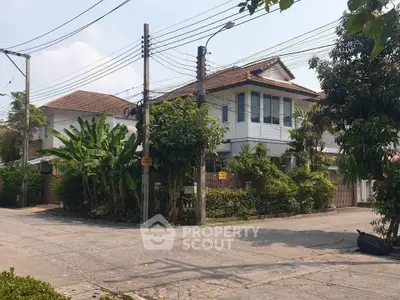 Charming corner house with lush greenery and spacious layout in a serene neighborhood.