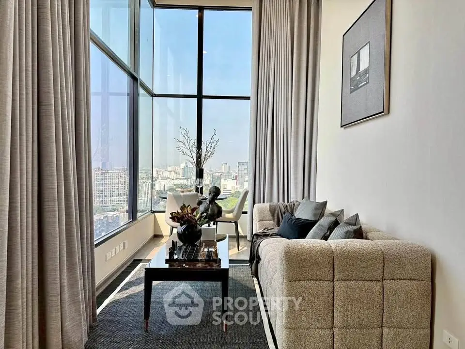 Luxurious high-rise living room with panoramic city views and elegant decor.