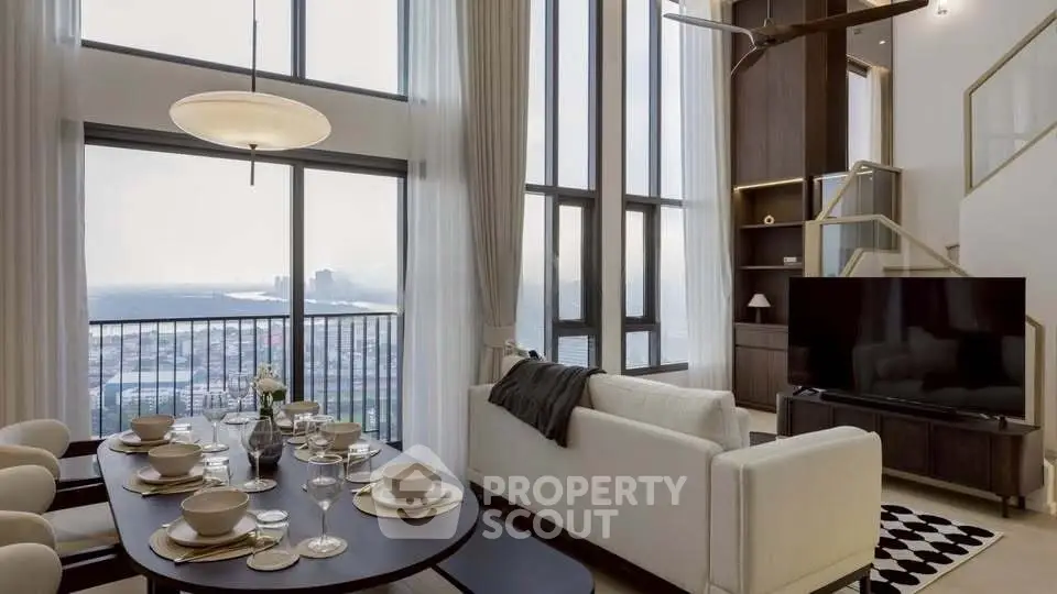 Luxurious high-rise living room with stunning city view and elegant dining area.