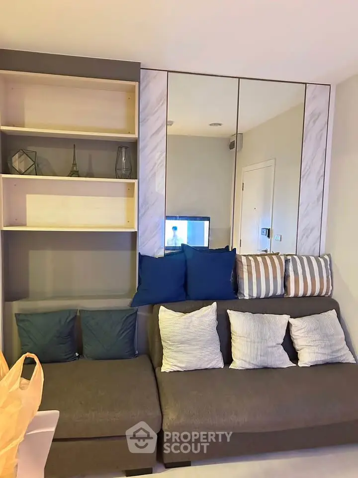 Modern living room with stylish sofa and decorative shelving