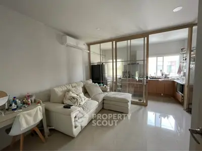 Modern living room with glass partition and cozy white sofa