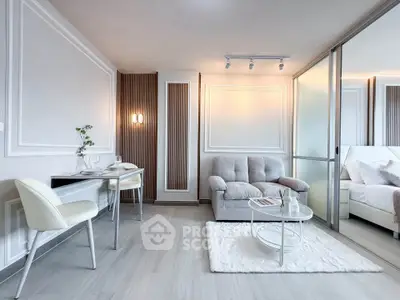 Modern living room with elegant decor and cozy seating area in a stylish apartment.