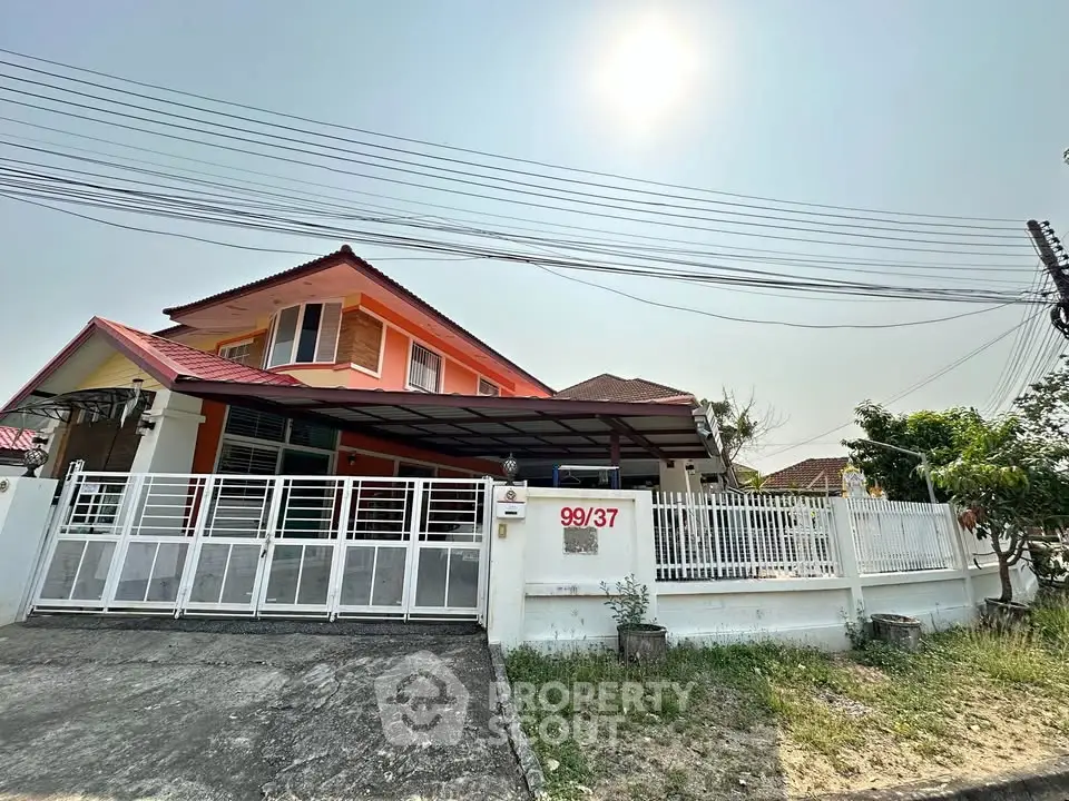 Charming two-story house with spacious yard and modern design in a sunny neighborhood.