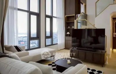 Luxurious high-rise living room with stunning city view and modern decor.