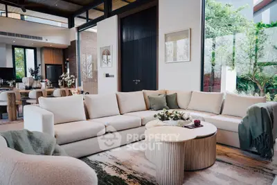 Luxurious modern living room with elegant beige sectional sofa and stylish decor, perfect for entertaining.