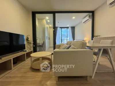 Modern living room with stylish furniture and city view balcony