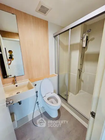 Modern bathroom with shower enclosure and sleek fixtures