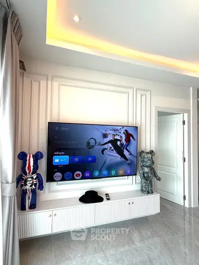 Modern living room with wall-mounted TV and stylish decor