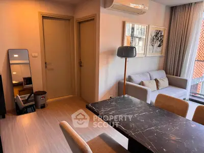 Modern living room with stylish furniture and elegant decor in a cozy apartment setting.