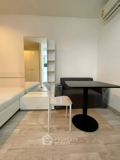 Modern studio apartment with minimalist furniture and cozy ambiance