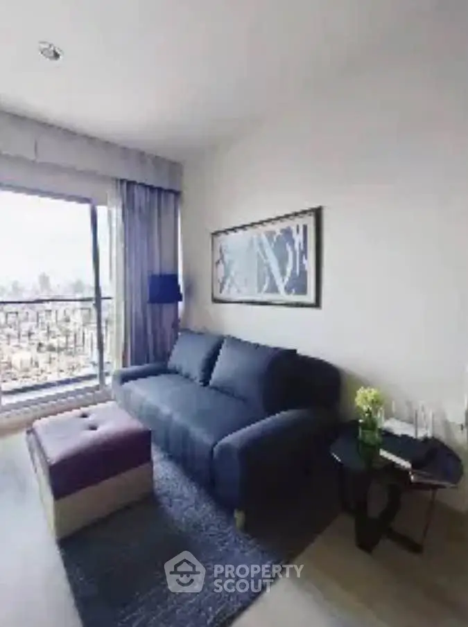 Chic living room with modern sofa and balcony view in stylish apartment.