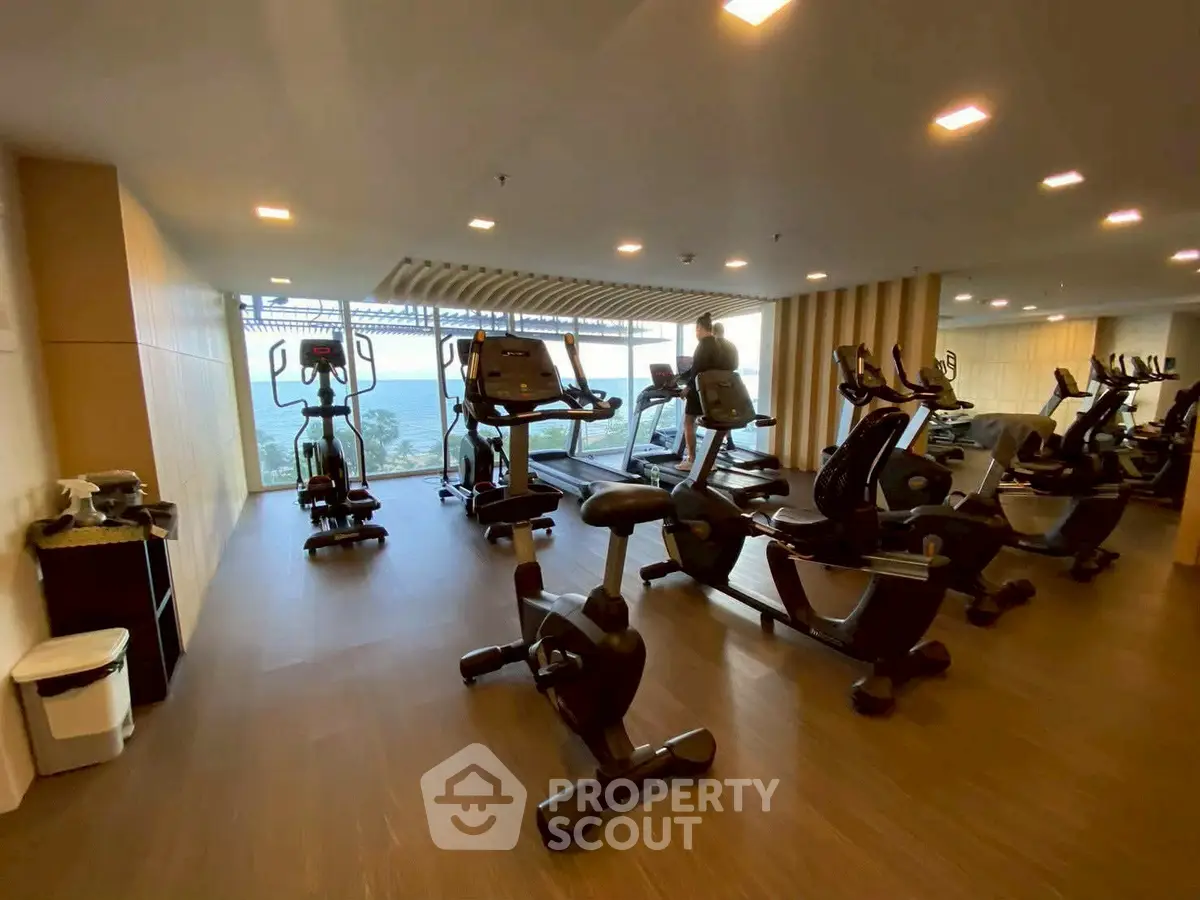 Modern gym with state-of-the-art equipment and panoramic views, perfect for fitness enthusiasts.