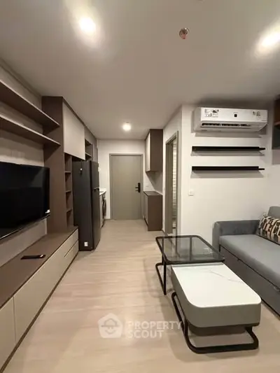 Modern living room with sleek furniture and built-in shelves