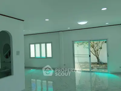 Spacious modern living room with marble flooring and large windows
