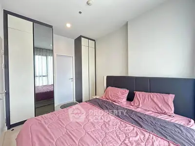 Modern bedroom with stylish decor and ample natural light