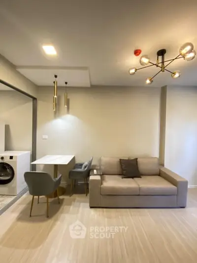 Modern living room with stylish lighting and cozy seating area