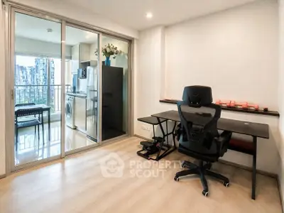 Modern study room with balcony view and laundry area in sleek apartment