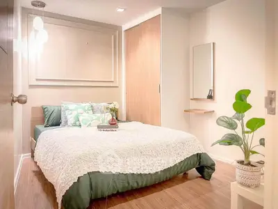 Cozy modern bedroom with stylish decor and natural light