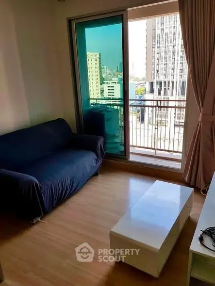 Cozy living room with balcony view in modern apartment