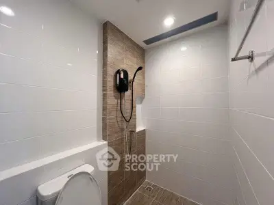 Modern bathroom with sleek shower and tiled walls