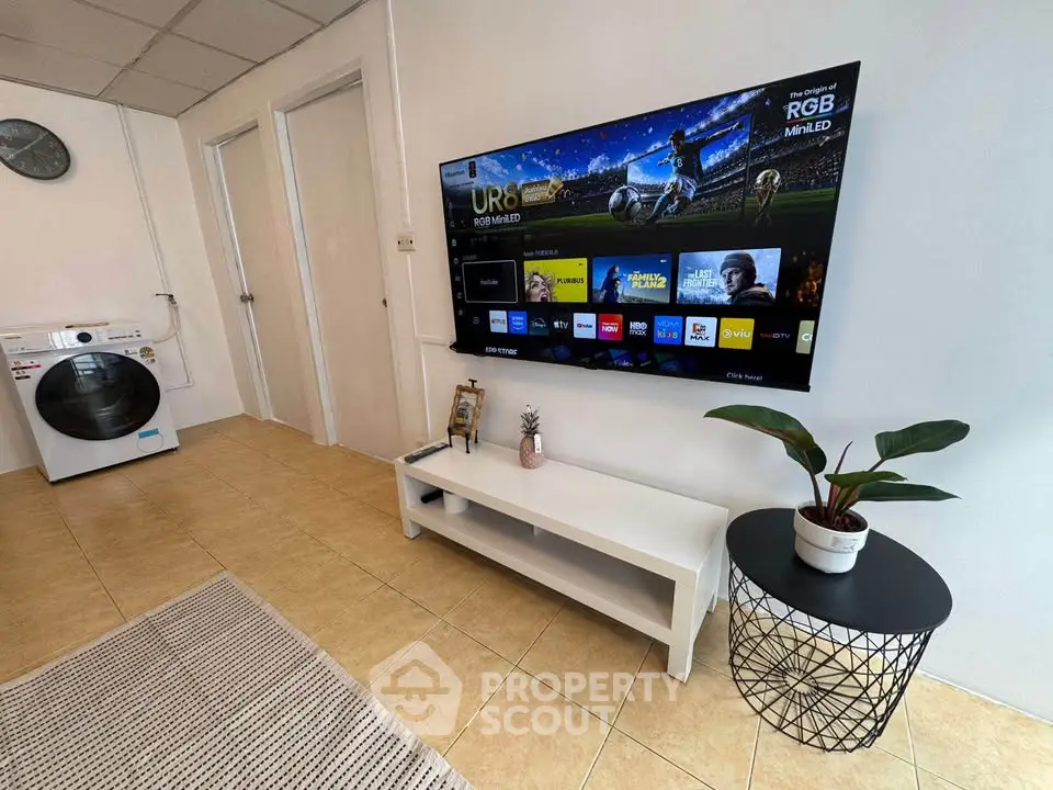 Modern living room with wall-mounted TV and stylish decor