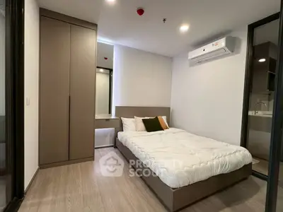 Modern minimalist bedroom with sleek design and built-in wardrobe