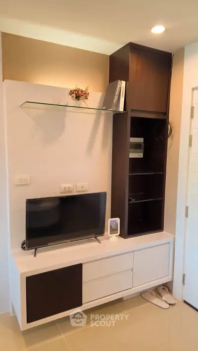 Modern living room with sleek TV unit and stylish shelving