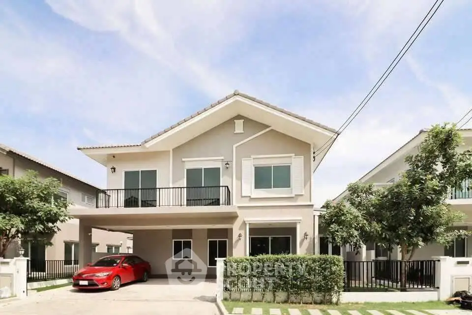Charming two-story house with spacious driveway and modern design in a serene neighborhood.