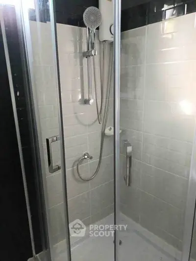 Modern bathroom shower with glass enclosure and sleek fixtures