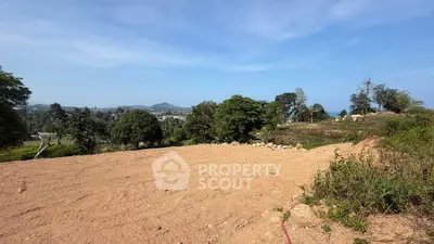 Expansive land plot with scenic views, perfect for development in a serene location.