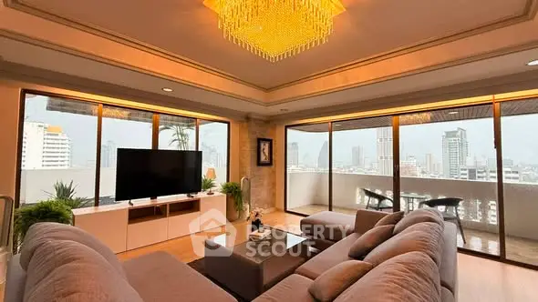 Luxurious living room with panoramic city view and elegant chandelier