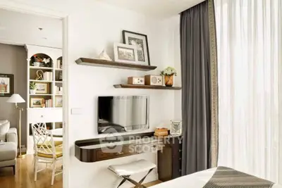 Chic modern living room with stylish shelving and wall-mounted TV, perfect for urban living.