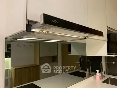 Modern kitchen with sleek extractor hood and minimalist design