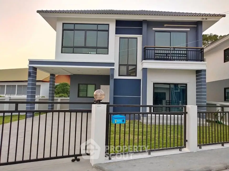 Modern two-story house with sleek design and spacious driveway