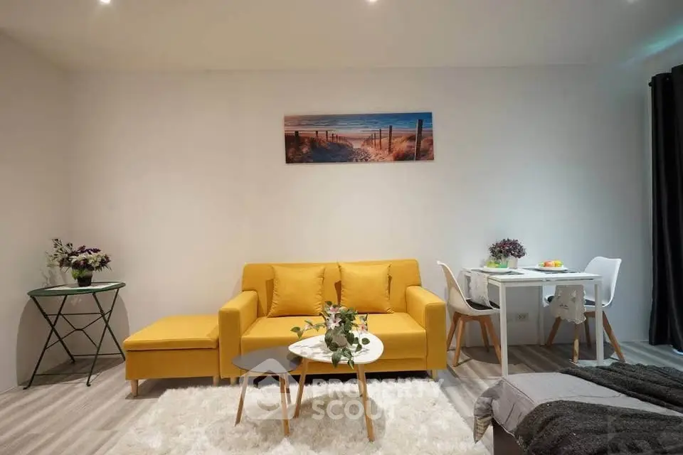 Stylish living room with vibrant yellow sofa and modern decor