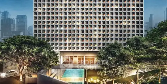 Modern high-rise building with pool and lush greenery in urban setting.