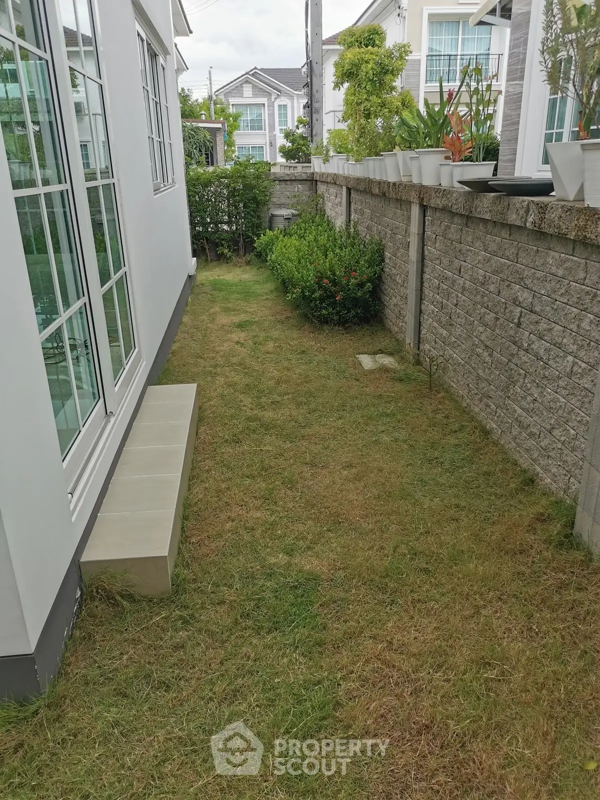 Charming garden space with lush greenery and modern exterior design