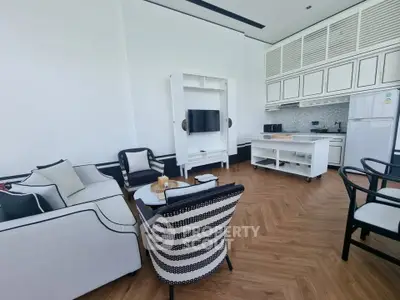 Elegant open-layout living room with modern kitchen and stylish furniture