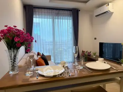 Modern living room with dining setup and city view through large window.