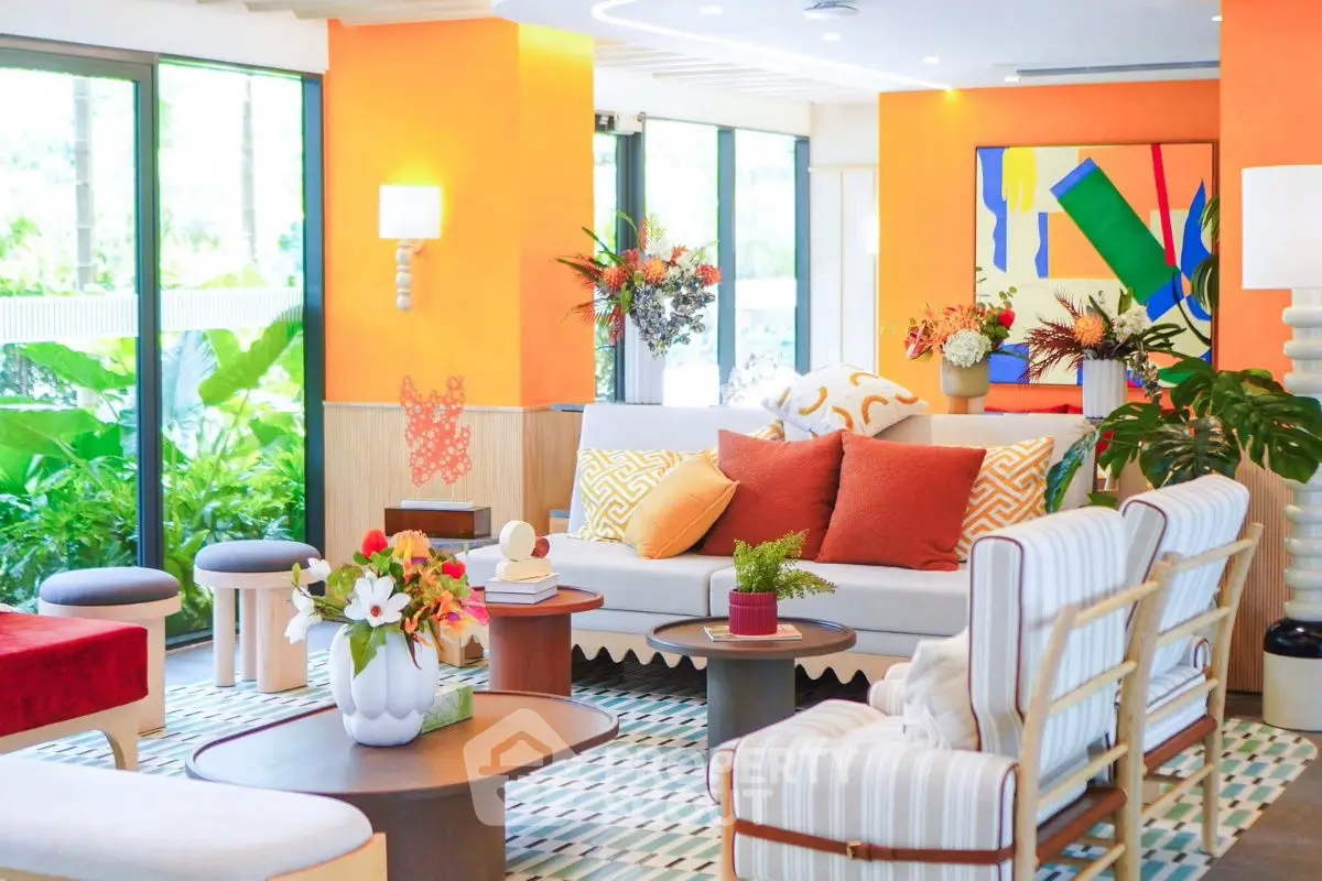 Vibrant living room with modern decor and large windows overlooking lush greenery.