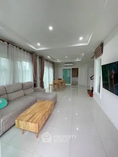 Spacious modern living room with sleek furniture and open layout