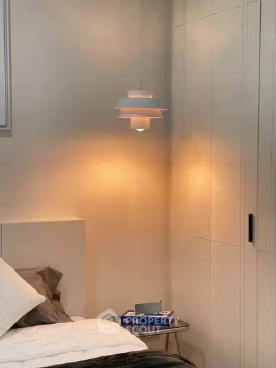 Cozy bedroom with modern lighting and sleek wardrobe design