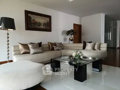 Elegant living room with modern decor and plush seating