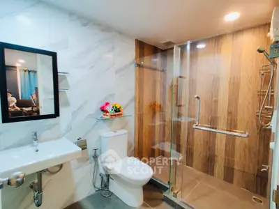 Modern bathroom with glass shower and elegant marble tiles