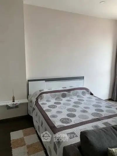 Cozy bedroom with modern decor and stylish bedspread