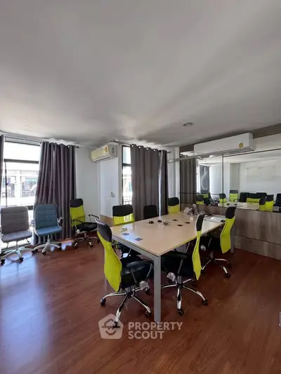 Modern office space with conference table and ergonomic chairs