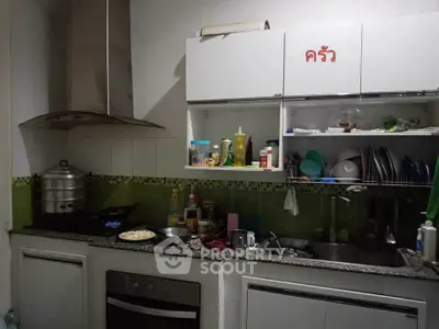 Cozy kitchen with modern appliances and ample storage space.