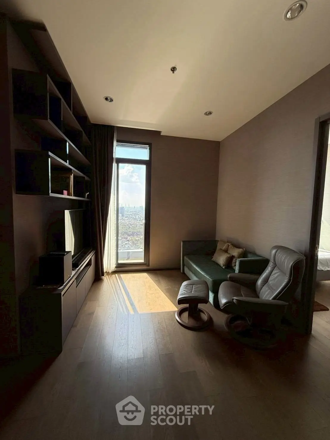 Cozy study room with city view, featuring modern furniture and ample natural light.