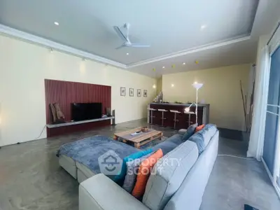 Spacious modern living room with open kitchen and stylish decor