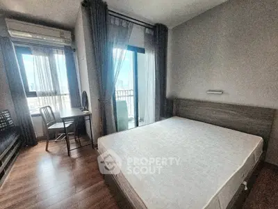 Modern bedroom with balcony view in urban apartment